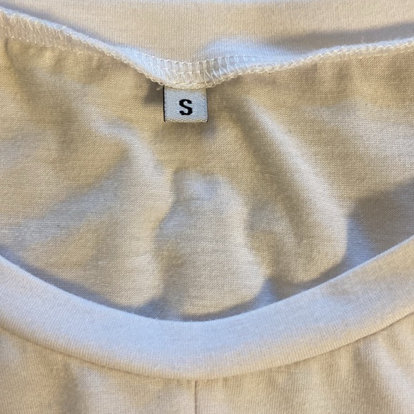White t-shirt. Criss cross bottom. Size small. New without tag. - Picture 2 of 3